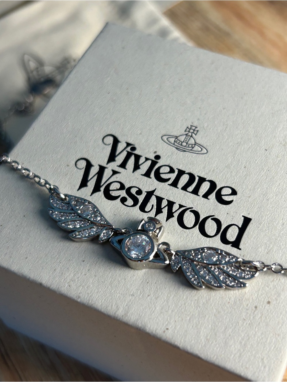 Vivienne Westwood Silver Winged Orb Necklace with Pink Crystals